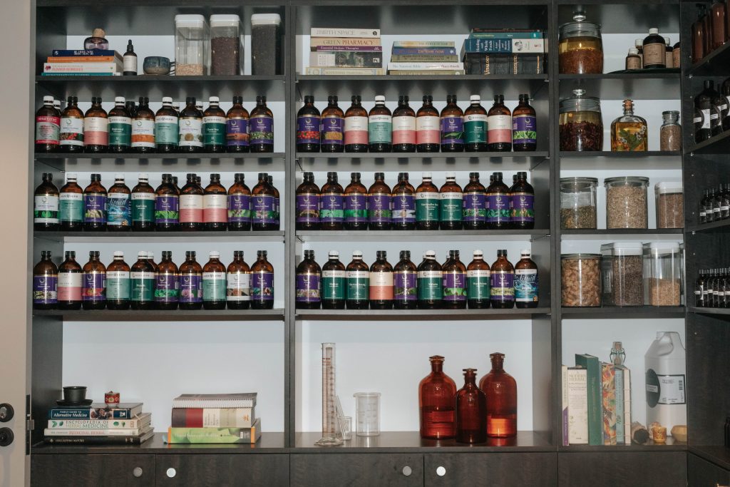 Shelving units that contain neatly placed bottles of products.